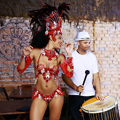 Image showing Women, samba dancer and carnival with smile, stage and band with fashion, culture or creativity in nightclub. Girl, people and dancing with music, drums or tradition for celebration in Rio de Janeiro