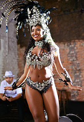 Image showing Women, samba dancer and happy at carnival, stage and band with fashion, culture or creativity in nightclub. Girl, people and dancing with music, drums or tradition for celebration in Rio de Janeiro