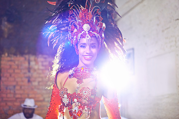 Image showing Woman, samba and performance with portrait, smile and makeup for concert or party. Brazilian dancer, celebration and feather for culture, talent and creative artist for rio de janeiro carnival event