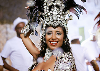 Image showing Portrait, happy woman and dancer at carnival with band for performance, party or celebration. Face, samba and Brazilian person at music festival in feather costume, makeup and smile at concert event