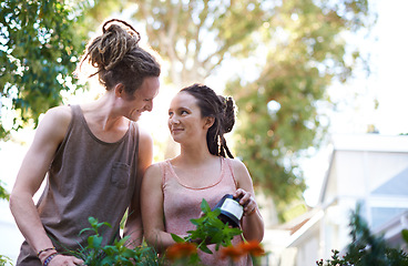 Image showing Happy couple, man and woman with plants in garden, harvest and sustainability of herbs for growth. People, working and caring for vegetables together with smile, dating and bonding in relationship
