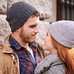 Image showing Couple, love and smile with closeup in outdoor at sidewalk or against in cold weather, together and support in London. Relationship, date and bonding for romance with soulmate, care and happiness