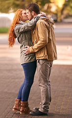 Image showing Couple, love and kiss with affection at park or outdoor in cold weather, together and support in new York. Relationship, date and bonding for romance with desire, care and happiness with commitment