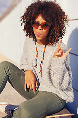 Image showing Woman, fashion and portrait with skateboard in city for skate, crazy and break in urban for summer, fun and silly. African person and tongue out with shades for happy, trendy and cool for funky