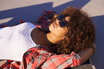 Image showing Black woman, sunglasses and think with skateboard at skatepark or outdoor to think, vision and contemplate in Atlanta. Relax, female person and skater with hobby or sport for training and workout