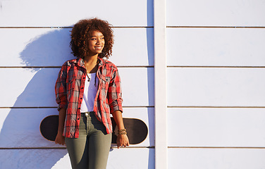 Image showing Skateboard, fashion and black woman in skatepark for exercise, training and skating in city. Skater, smile and happy female person for trendy, edgy style and hipster clothing in San Francisco