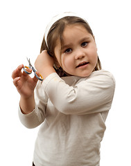 Image showing Child Cutting Their Own Hair