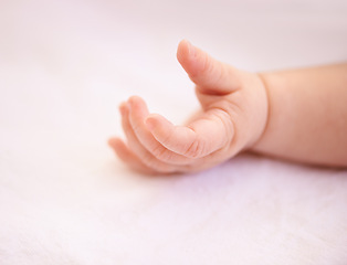 Image showing Fingers, hands and rest with closeup baby, tired kid on duvet for relaxing comfort in nursery. Child development, peaceful infant or newborn toddler, wellness and calm in bedroom of family home