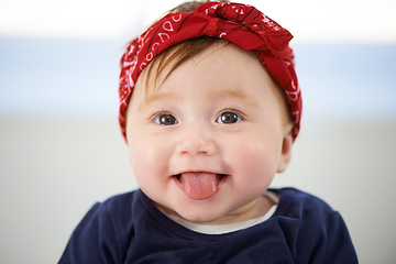 Image showing Portrait, tongue and cheerful baby fashion in family home, cute and trendy street style on curious girl toddler. Creative, child development and growth, adorable headband accessory on happy smile kid