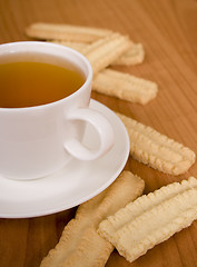 Image showing cup of tea and some cookies