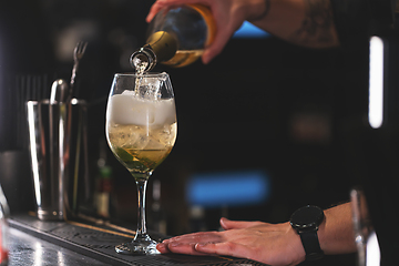 Image showing Bartender pouring cocktail