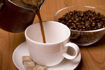 Image showing cup of coffee, sugar and beans