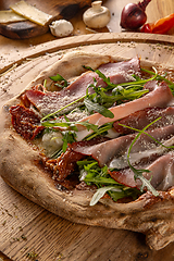 Image showing Close up of rustic homemade pizza