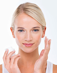 Image showing Woman, portrait and moisturiser product for skincare healthy or dermatology wellness, cream or white background. Female person, face and hand with lotion in studio for self care, sunscreen or mockup