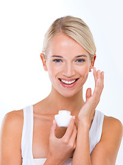 Image showing Woman, portrait and skincare cream in studio or moisturizer wellness with dermatology, product or white background. Female person, lotion and facial sunscreen or self care protection, smile or mockup