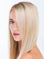 Image showing Woman, blonde hair and studio portrait with beauty, wellness and results by white background. Girl, person and model with long hairstyle, transformation and change with natural glow for aesthetic