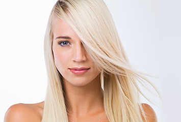 Image showing Blonde woman, long hair and studio portrait with beauty, wellness and results by white background. Girl, person and model with hairstyle, transformation and change with natural glow for health