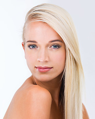 Image showing Blonde woman, hairstyle and studio portrait with beauty, wellness and results by white background. Girl, person and model with hair care, transformation and change with natural glow for health