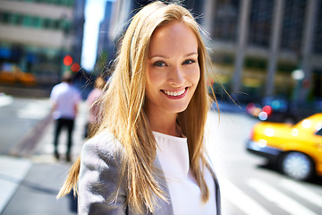 Image showing Woman, smile and portrait in city for travel, walk and break in urban for work, cab or job in outdoor. Young person and happy with confidence for move in New York for journey in town with traffic