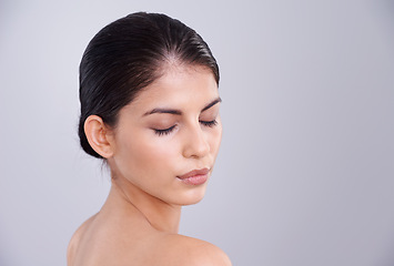 Image showing Beauty, skincare and woman with eyes closed in studio, clean and natural with cosmetic care and wellness on grey background. Facial, treatment and dermatology, peace with healthy skin and shine