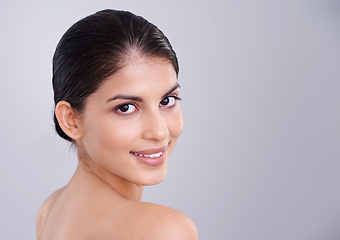 Image showing Beauty, skincare and woman in portrait in studio, clean and natural with cosmetic care and wellness isolated on grey background. Facial, treatment and dermatology, happy with healthy skin and shine