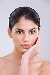 Image showing Beauty, skin and woman in portrait in studio, clean and natural with cosmetic care and wellness isolated on grey background. Facial, treatment and dermatology, face with healthy glow and shine