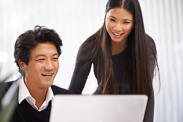 Image showing Happy, mentor and teamwork on laptop in office with businessman learning from support of woman. Feedback, advice or manager training asian man on computer in collaboration and reading online research