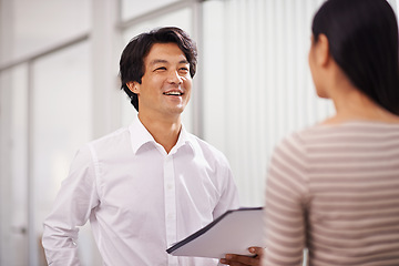 Image showing Office, partnership and Asian business people in discussion, conversation and talking with documents. Meeting, creative agency and man and woman with project for planning, collaboration and teamwork