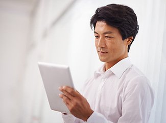 Image showing Tablet, professional and asian business man online for reading email, communication and internet research in office. Corporate, technology and Japanese male employee for search, website and planning