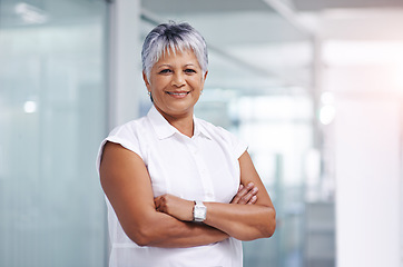 Image showing Business woman, senior and smile with arms crossed in portrait at office, confidence and pride in career. Boss, executive or CEO of sales company, happy expert or entrepreneur with ambition and power