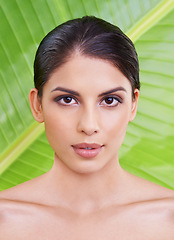 Image showing Skin, woman and beauty with palm leaf background, makeup and natural skincare with dermatology. Organic, nature and eco friendly cosmetics in portrait, clean with wellness and sustainable treatment