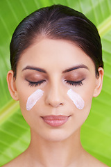 Image showing Cream, woman and beauty with palm leaf background, moisturizer and natural skincare with dermatology. Organic, nature and eco cosmetics with lotion, sunscreen and eyeshadow with sustainable facial