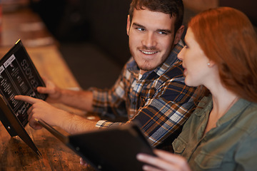 Image showing Happy couple, restaurant and reading with menu for option, choice or decision on romantic dinner date. Man and woman with smile for meal, selection or pick on price list at indoor coffee shop or cafe