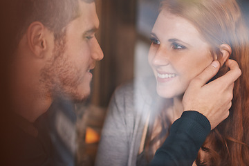 Image showing Happy couple, love and support with affection at cafe for romance or care together at indoor restaurant. Face of man and woman with smile for date, relationship or romantic bonding at coffee shop