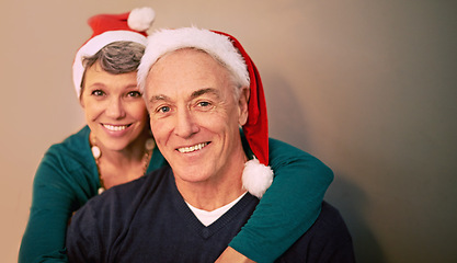 Image showing Christmas, portrait and senior couple with love, holiday and support together in home with romance. Happy, retirement and marriage with smile and hug in house with celebration and santa hat with joy