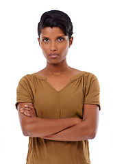 Image showing Indian woman, fashion and arms crossed in studio portrait with confidence, pride and serious by white background. Girl, person and cool model with edgy outfit, shirt and trendy style in Mumbai