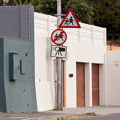 Image showing Road sign, warning and signage in street for pedestrian with caution notification or neighborhood outdoor in city. Attention, public notice or signpost with alert message and symbol with no speeding