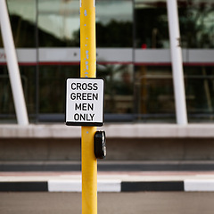 Image showing Street, traffic light and sign for pedestrian by crosswalk with mistake for humor, joke or comic grammar in city. Asphalt, error and funny signage with board, poster and design with warning in town