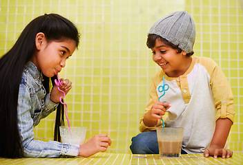 Image showing Children, fun and siblings on a floor with milk, chocolate or smoothie games, challenge or drinking competition at home. Love, family and children bonding with liquid contest in house with milkshake