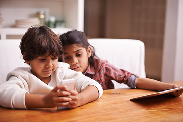 Image showing Phone, search and kid siblings with tablet in a kitchen for google it, gaming or bonding at home. Family, subscription and children in a house with online service, sign up or vacation entertainment