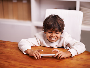 Image showing Phone, search and happy boy kid in a kitchen for google it, gaming or sign up at home. Smartphone, smile and kid person in a house online for streaming, video or cartoon, film or Netflix and chill