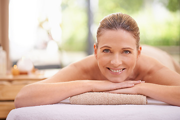 Image showing Portrait, girl or wellness in luxury, massage or spa as peace, self care or beauty therapy. Natural, smile or woman on table, towel or detox as balance, cosmetology or bodycare in zen retreat