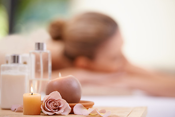 Image showing Candle, rose and holistic healing at spa for aromatherapy, wellness and treatment for self care. Detox, stress relief and energy balance for aura with tools, luxury and natural with zen and calm