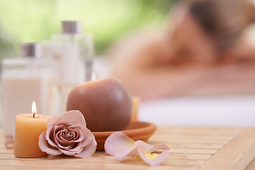 Image showing Candles, rose and holistic healing at spa with aromatherapy, wellness and treatment for self care. Detox, stress relief and energy balance for aura with tools, luxury and natural with zen and calm