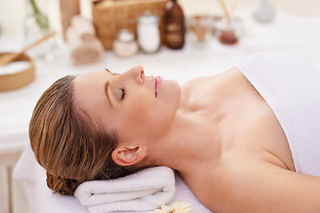 Image showing Woman, face and top view with eyes closed at spa, massage and wellness with calm for zen and self care. Cosmetics, beauty and holistic healing, relax and peace at luxury resort with treatment