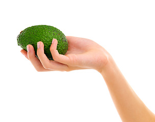 Image showing Nutrition, avocado and hand in studio for healthy diet, wellness and vitamin c on white background. Fruit, green and holding for delicious ingredients, organic food and vegetarian meal with mockup