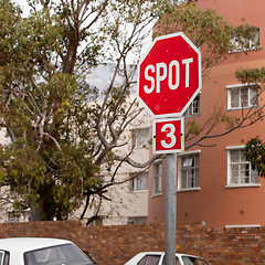 Image showing Road, city and outdoor with stop sign, mistake or typo for humor with comic text in neighborhood. Spot, error and joke with funny signage with writing, language or wrong spelling for warning in town