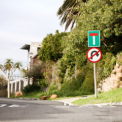 Image showing Road sign, warning and signage in street for dead end with caution notification or neighborhood outdoor in city. Attention, public notice or signpost with alert message and symbol with trees or house