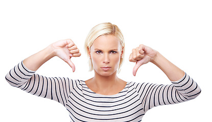 Image showing Woman, angry and thumbs down with review in portrait, body language or disagreement with fail on white background. Hand gesture, emoji with rejection or negative feedback, bad results and opinion