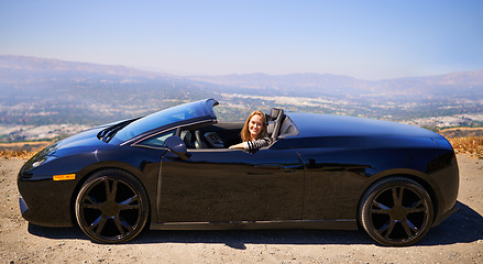 Image showing Woman, portrait and happy in sports car for road trip in summer or adventure on vacation in Beverly Hills. Luxury vehicle for speed on highway, transport and drive on mountain for journey or freedom.